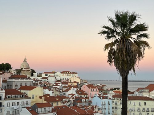 Twilight settles in at the Miradouro de Santa Luzia.